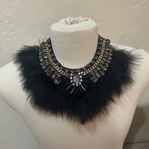 Elegant Black Feather and Rhinestone Collar with Gold Adornment.
